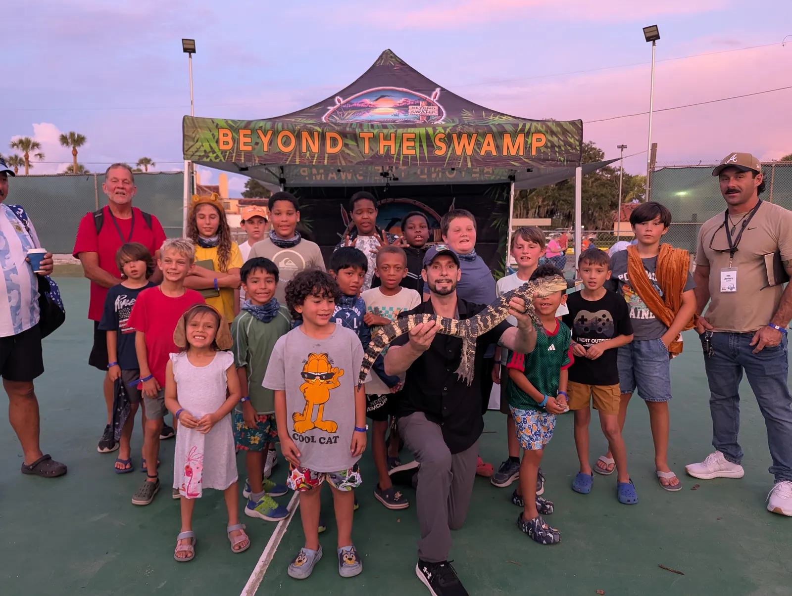 Campers gathered in front of the Beyond the Swamp animal show tent