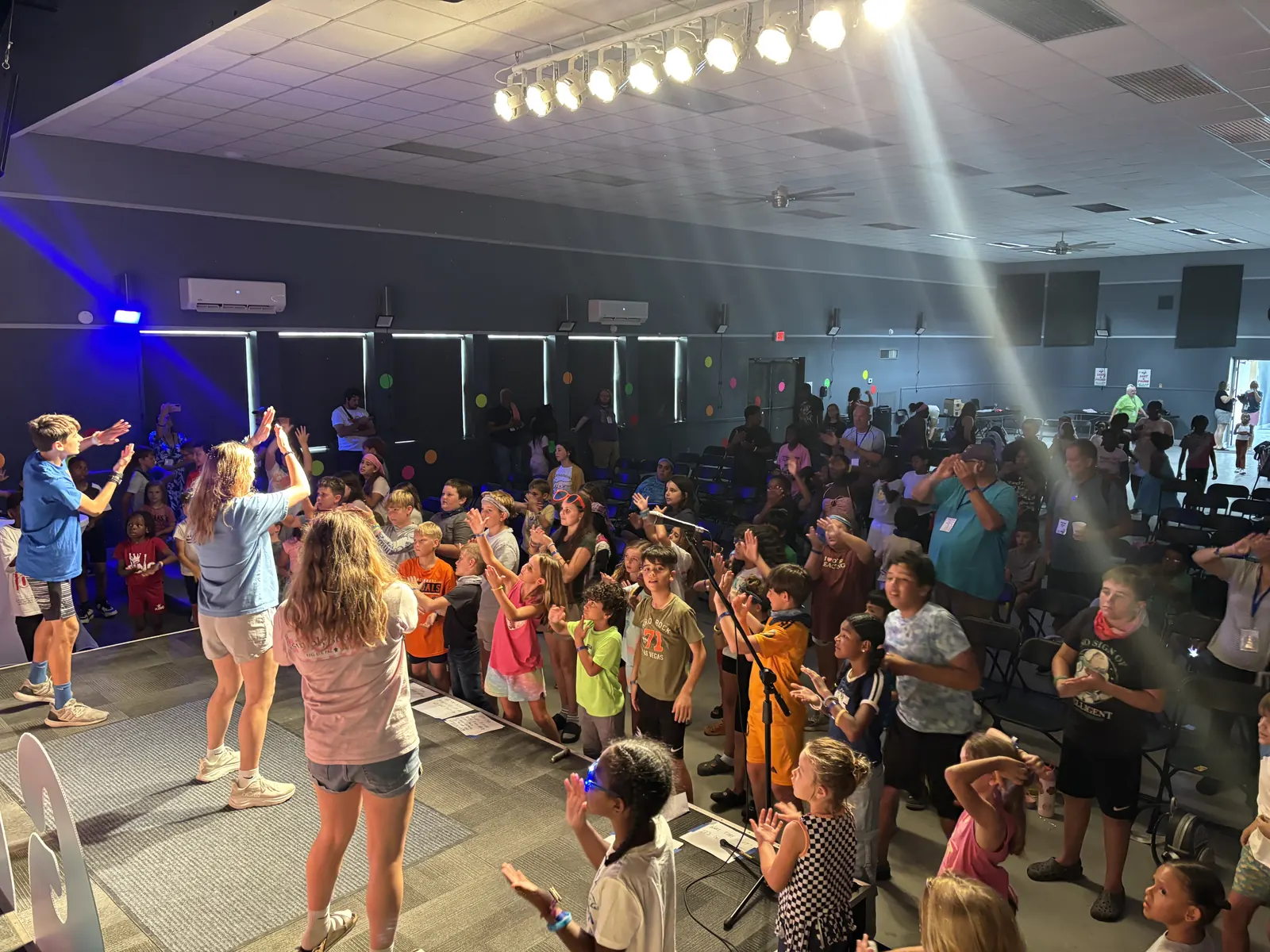 Kids singing and dancing during chapel worship