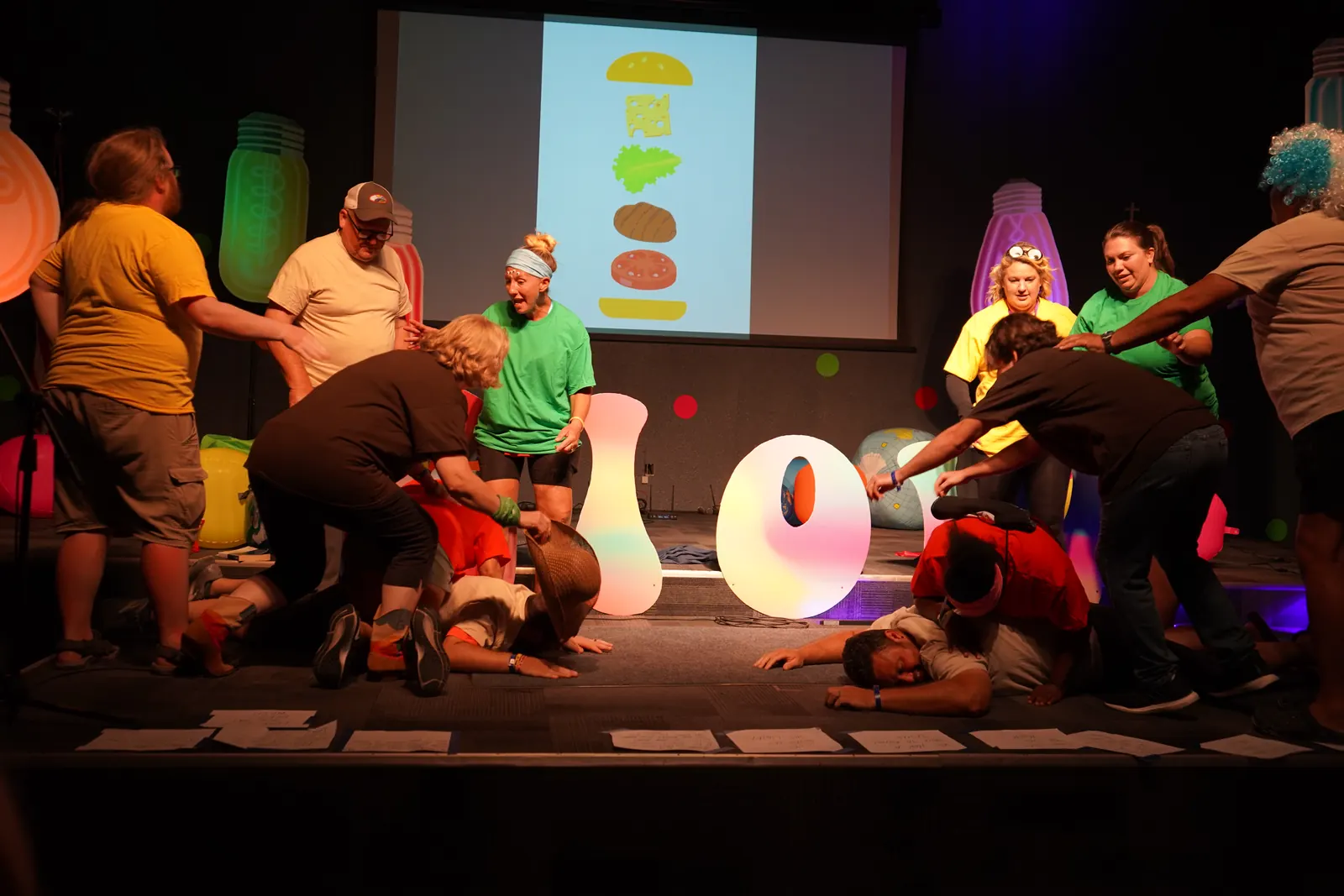 Leaders acting out a skit on the GLOW stage