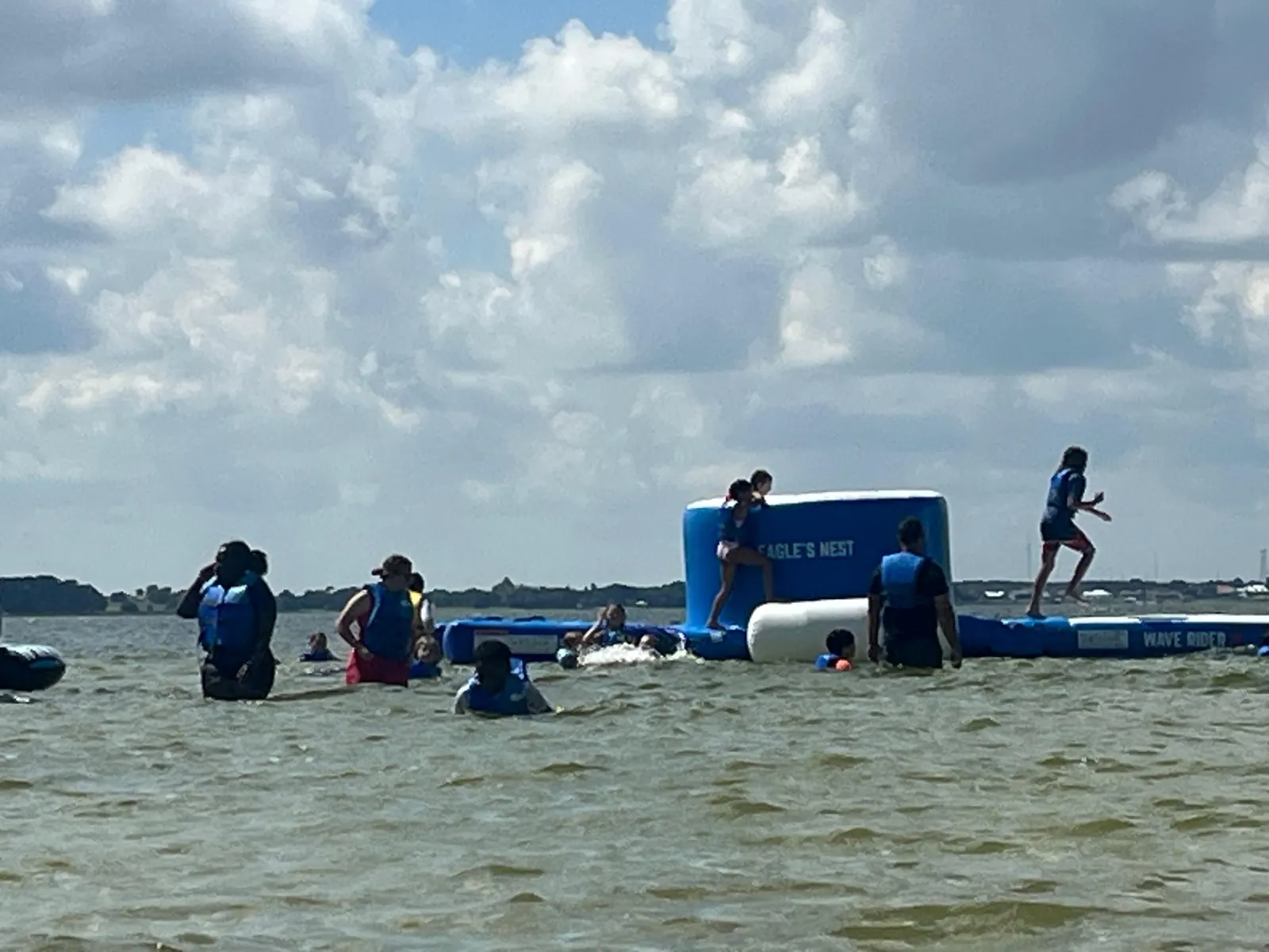 Campers swimming near the lake inflatable
