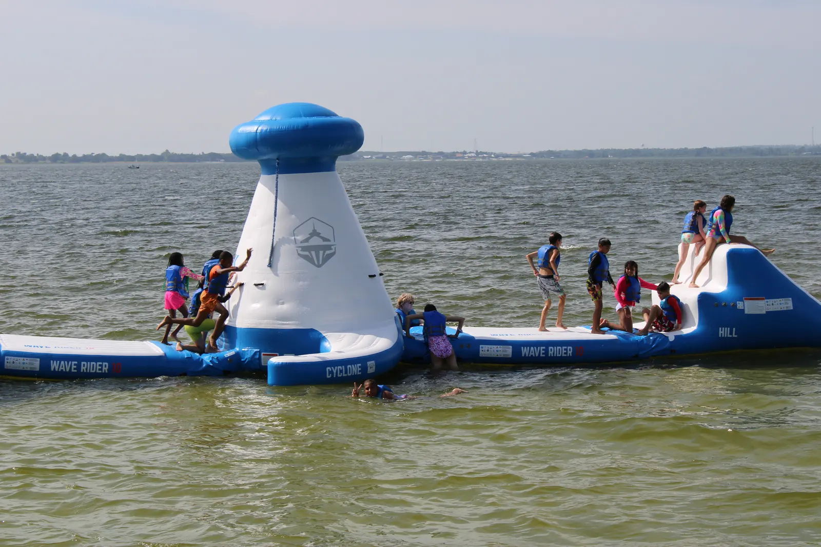 Campers playing on the lake inflatable