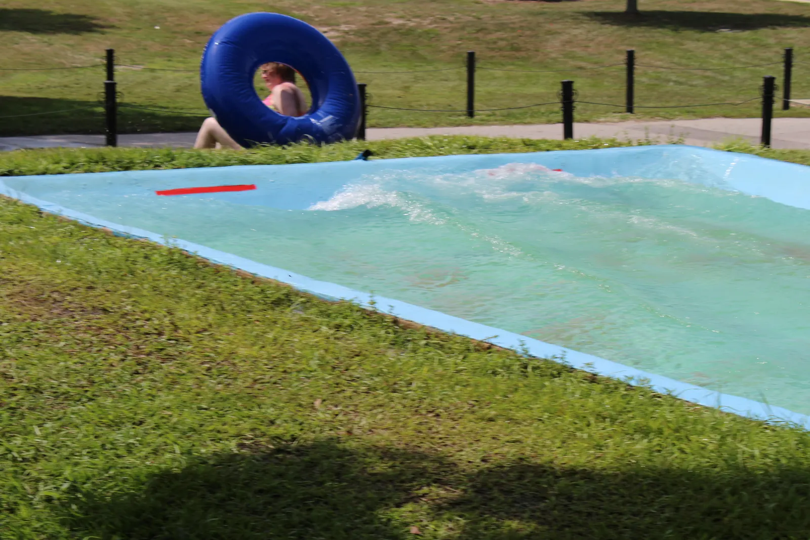 A big splash at the bottom of the slip 'n slide