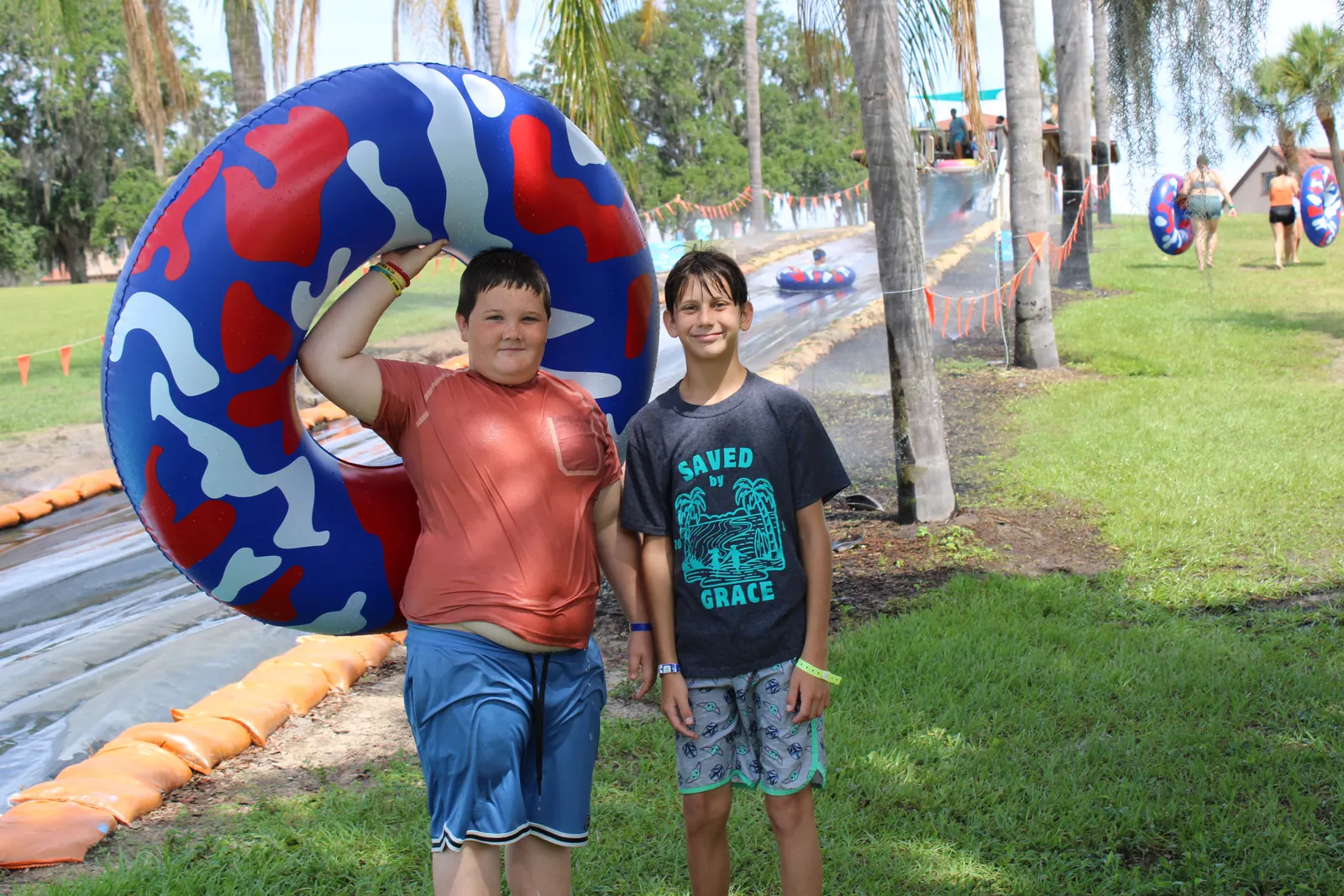 Two campers with a giant pool float