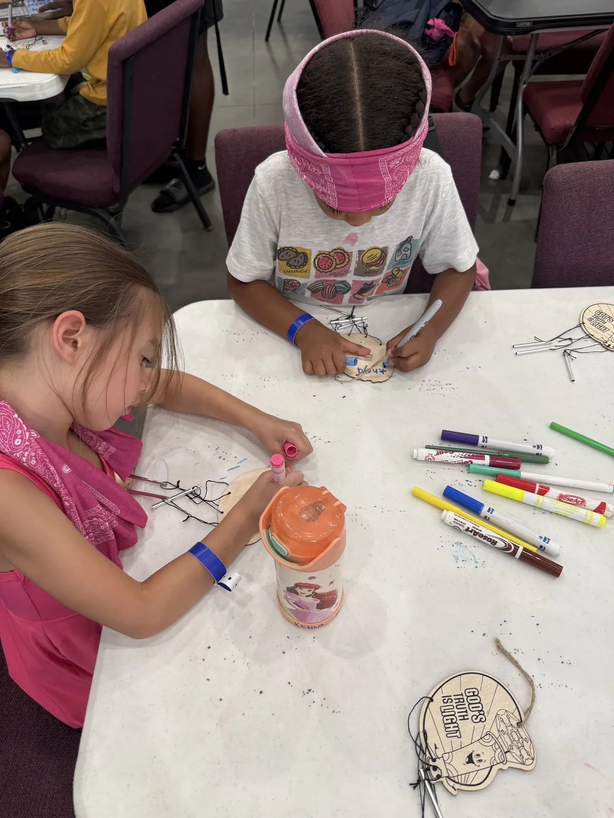 Campers decorating their crafts